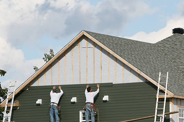 Professional Storm Damage Siding Repair technician working in Clinton, IN